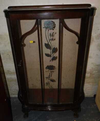 A mahogany glazed display cabinet, with rose motif to glazing, bow fronted detail, raised on cabriole legs.