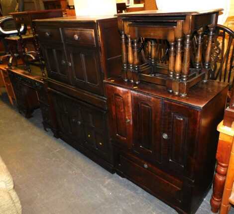 A stained oak TV cabinet, 80cm wide x 100cm high x 44cm deep, sideboard with frieze drawers, low cupboards, and a sideboard with double cupboard doors, raised and fielded panel doors, 100cm wide x 70cm high x 50cm deep, together with a nest of tables. (4)