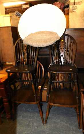 Four oak wheel back kitchen chairs, including two carvers, together with a mid century Lloyd Loom bedroom chair. (5)