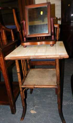 A bamboo occasional table, with tile inset top, 48cm wide x 70cm high, together with a mahogany toilet mirror. (2)