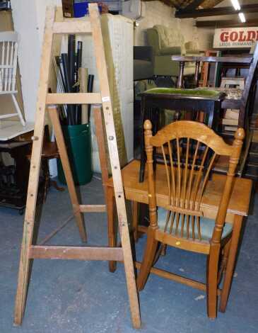 An oak occasional table, together with an A frame easel, a stool, and a beech dining chair.