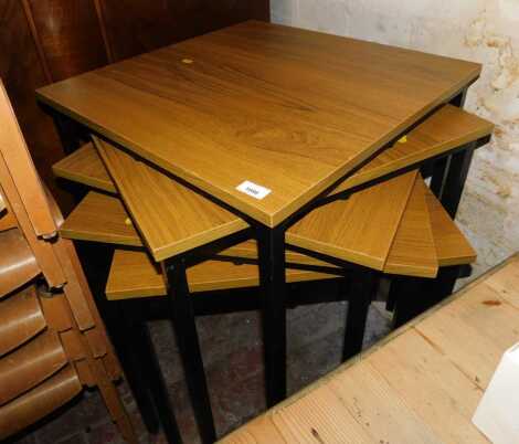 Five 20thC occasional tables, each with a veneered top, on square metal legs.