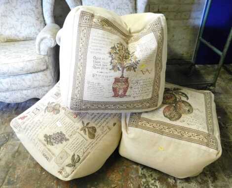 Three upholstered pouffes.