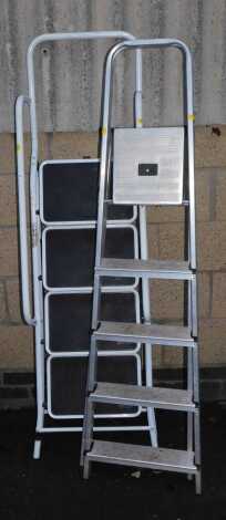 A metal extending step ladder, and another.