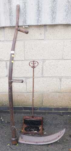 A Scythe, together with a cast iron boot scraper.