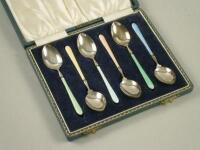 A Harlequin set of six silver and coloured enamel coffee spoons