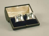 A pair of silver napkin rings