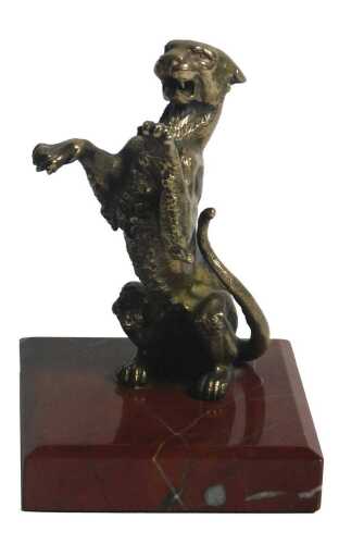 A Continental cast bronze figure of a rearing leopard, on a square rouge marble base, 15cm high.