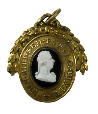 A George III small medallion, by William Tassie for the Pitt Club, in memory of The Rt Hon William Pitt who died 23rd January 1806 aged 47, engraved to the reverse 'Colonel Brown,' the front decorated with a central cameo, and with the Latin motto Non Sib