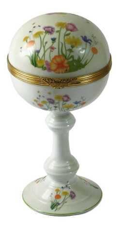 A Raynaud & Co Limoges porcelain box and cover, decorated with brightly coloured flowers, on a turned stem, tapering base, printed marks to underside, 29cm high.