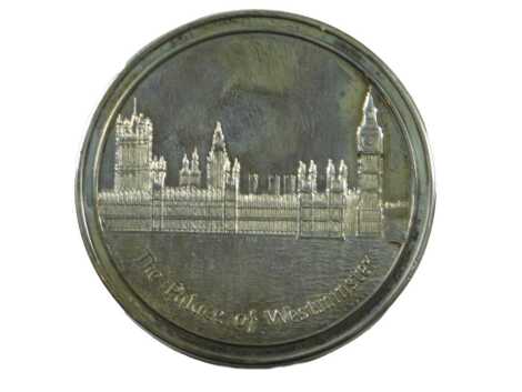 A white coloured metal Tower Mint medallion of the Palace of Westminster, boxed.