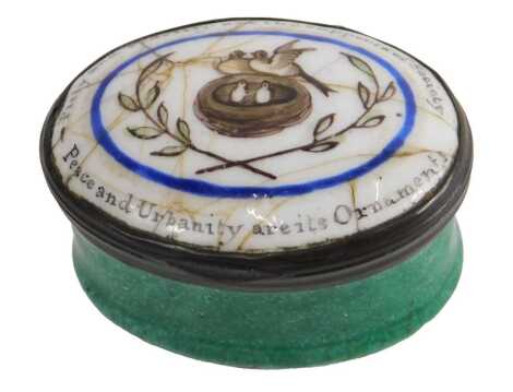 An oval Staffordshire enamel patch box, decorated centrally with two birds, a nest and laurel leaves, with the inscription Piety and fidelity are the supports of society, peace and urbanity are its ornaments, 5cm wide. (AF)