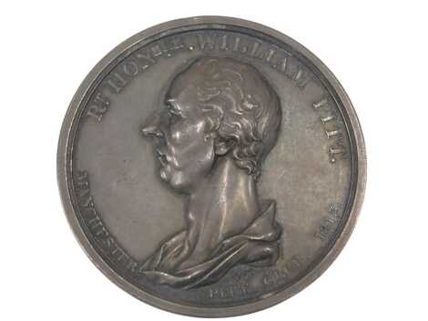 A silver coloured metal medallion, modelled with the profile of the Right Honorable William Pitt, Manchester Pit Club 1813, the reverse titled Himself and Host, 5cm diameter.