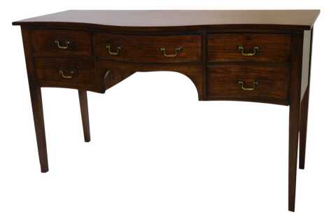 A mahogany sideboard, in Regency style, with a serpentine front, above an arrangement of five drawers, above an apron, on square tapering legs, probably Edwardian, 150cm wide.