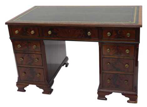 A late 19thC/ early 20thC Maple and Co mahogany kneehole desk, the top with a green leather inset above an arrangement of nine drawers on ogee bracket feet, 77cm high, 121cm wide, 70cm deep. Upon initial inspection there is some scuffing to the leather on