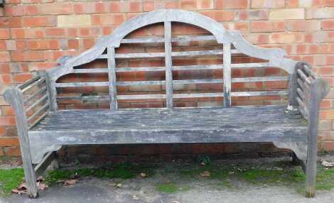 A Lutyens style hardwood garden bench, 180cm wide.