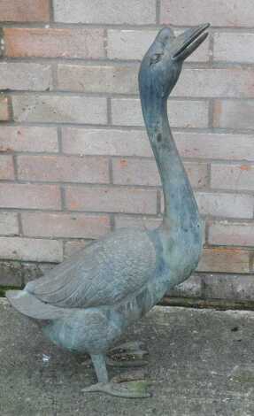 An Oriental style case bronzed metal goose, 77cm long.