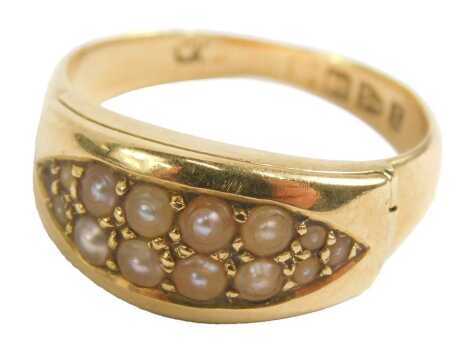 An 18ct gold memorial ring, set with six cultured pearls, with lift hinged memorial panel section, Chester 1911, 5.7g.