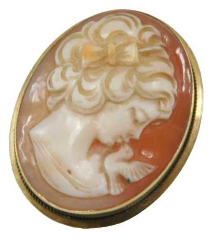 A shell cameo brooch, bust portrait of a lady with a dove, in yellow metal, stamped 750, 6.7g all in.