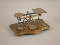A set of late Victorian-Edwardian oak and brass letter scales with some weights