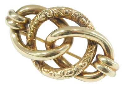 A Continental yellow metal brooch, embossed triple loop design, bears marks, 8.3g.