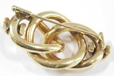 A Continental yellow metal brooch, embossed triple loop design, bears marks, 8.3g. - 2