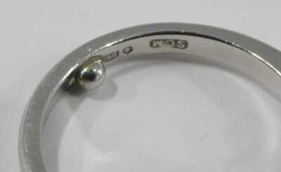 A platinum and diamond three stone ring, in high claw setting, approximately 0.5ct, stamped 950, size K, 4.7g. - 3