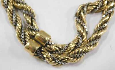 A bicolour two strand box and rope twist bracelet, on a snap clasp, stamped 750, 24.4g. - 2