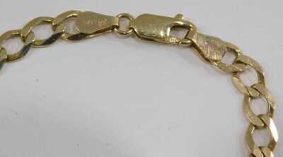 A 9ct gold curb link neck chain, on a lobster claw clasp, 11.8g. 23cm long. - 3