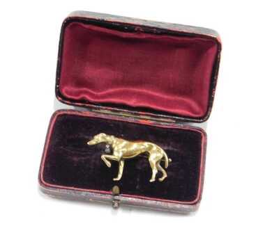 A Greyhound brooch, with a diamond set collar and tag, modelled with its front left paw raised, yellow metal, 15.8g. - 3