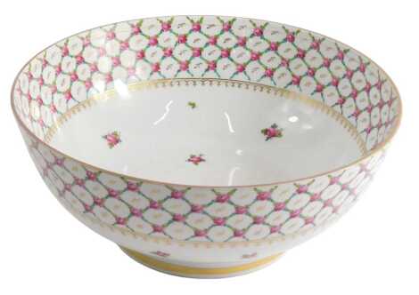 A late 19thC porcelain bowl, decorated with a design of roses and lattice within gilt borders, unmarked, 33cm diameter.