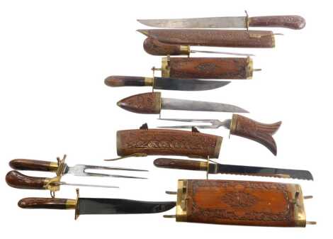 Four various Indian knives, to include carving set, etc., in hardwood and brass cases.