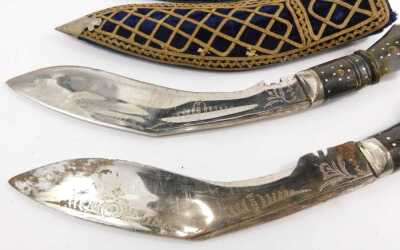 A pair of Indian Kukris, each with a horn handle, and fabric covered scabbard, and another similar. (3) - 2