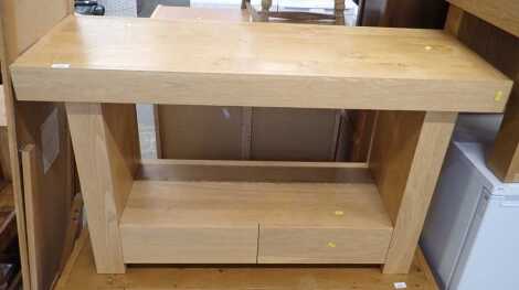 A John Lewis oak side table, the rectangular top with an undertier with two drawers, on rectangular end supports, 74cm high, 104cm wide, 44cm deep.