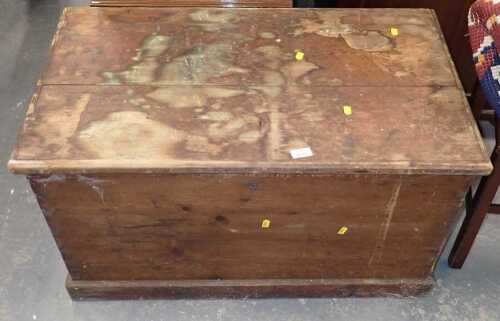 A pine blanket chest, the hinged top enclosing a vacant interior, on a plinth base, 49cm high, 89cm wide, 53cm deep. (AF)