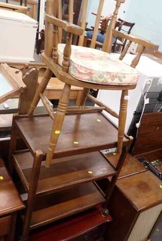 A group of furniture, comprising an oak three tier trolley, a television table, and a beech lath back open armchair.