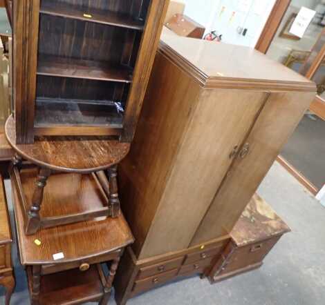 A group of furniture, comprising an oak drop leaf two tier trolley, a Compactum, an oak small bookcase, and an oak occasional table.