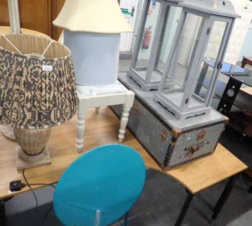 A travelling trunk, together with a limed oak standard lamp, table lamp, painted stool, etc. 
The upholstery in this lot does not comply with the 1988 (Fire & Fire Furnishing) Regulations, unless sold to a known exporter or upholsterer it will be cut from