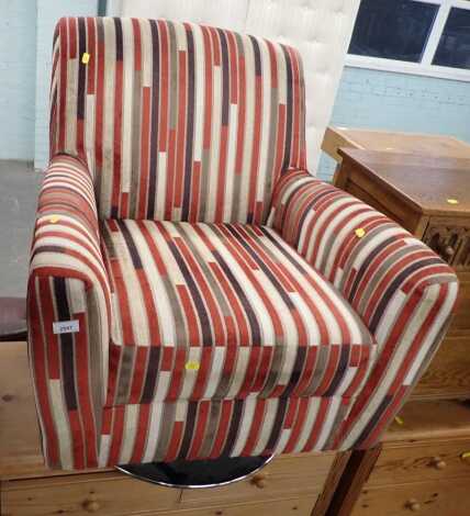 A swivel armchair, with striped fabric. 
The upholstery in this lot does not comply with the 1988 (Fire & Fire Furnishing) Regulations, unless sold to a known exporter or upholsterer it will be cut from the frame before leaving the premises.