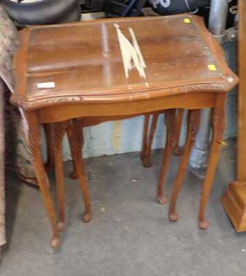 A yew nest of three tables, each inset with a glass panel.