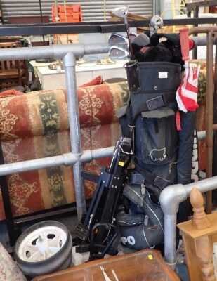 A Hippo golf bag, containing various Hippo Plus and other golf clubs, and a trolley.