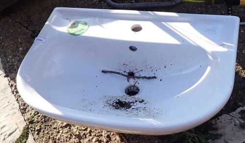 A Jika wall mounted sink basin.