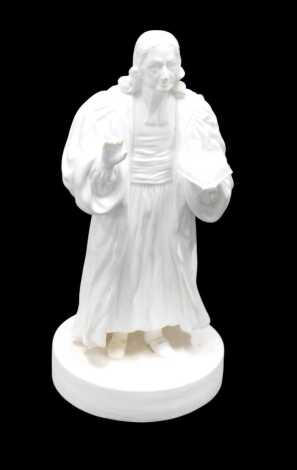 A 19thC Parian figure of John Wesley preaching, on a circular base, 19cm high.