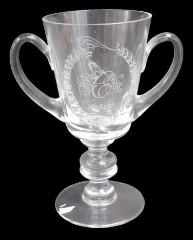 A modern two-handled glass loving cup, presented to Lord Cormack by the well-known TV personality Phil Drabble of One Man and His Dog fame, engraved by Daniel Whyman, 20cm high.