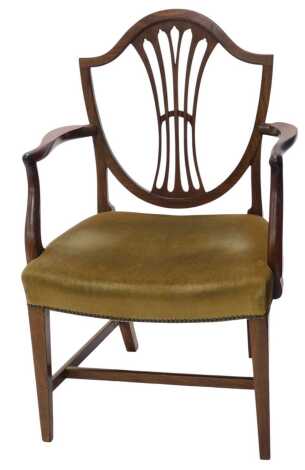 A George III mahogany open armchair, with a shield shaped back, with a vase shaped splat, the arms with shaped supports, padded seat on square tapering legs, with H stretcher.