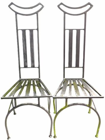 A pair of modern high back metal garden chairs. No apparent damage on initial inspection