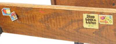 A 20thC oak school desk, with ink recess, a sloping hinged lid enclosing a vacant interior, with integrated bench, on a cast iron support, 81cm high. - 4