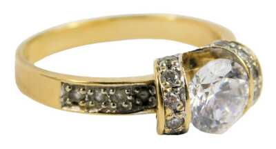 An 18ct gold dress ring, set with twenty one czs, the largest approx 3/4 carat, size M, 3.9g all in.