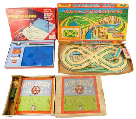 A Japanese Modern Toys Magic Crossroads tin windup set, together with two buses and a key, a Mini Series Mini Soccer game, boxed, and a Merit Reflectograph, all boxed.