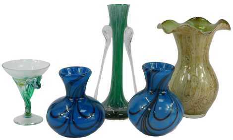 A group of decorative glassware, to include two similar globular vases, with an elongated neck, in a mottled turquoise colour way, radiating black line decoration, the largest 17cm high, together with a twin handled vase of tapering form, in mottled green